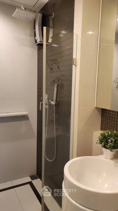 Modern bathroom with sleek shower and stylish sink, perfect for contemporary living.