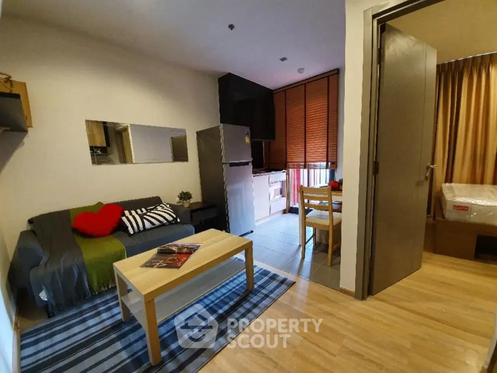 Cozy modern apartment interior with open living and dining area, featuring stylish decor and natural light.