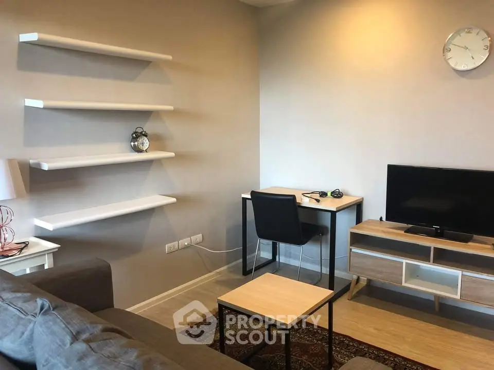Modern living room with sleek furniture and wall-mounted shelves, perfect for a cozy and stylish home.