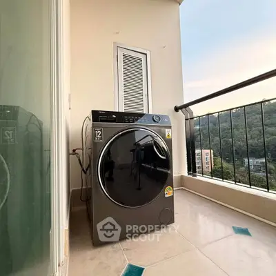 Modern washing machine on a balcony with scenic view, perfect for urban living convenience.