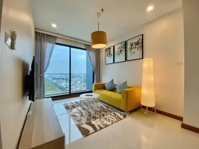 Modern living room with city view, stylish decor, and cozy yellow sofa.