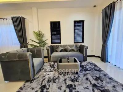 Stylish modern living room with plush gray sofas and elegant decor