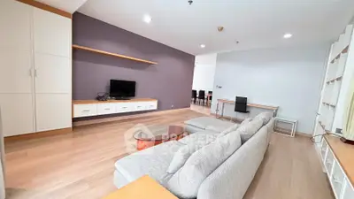 Spacious modern living room with sleek furniture and wooden flooring