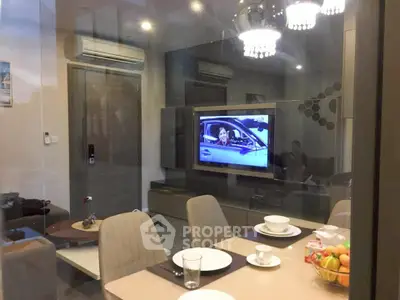 Modern living room with dining area and TV, featuring elegant lighting and contemporary decor.