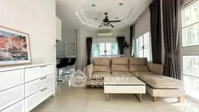 Spacious living room with modern decor and natural light