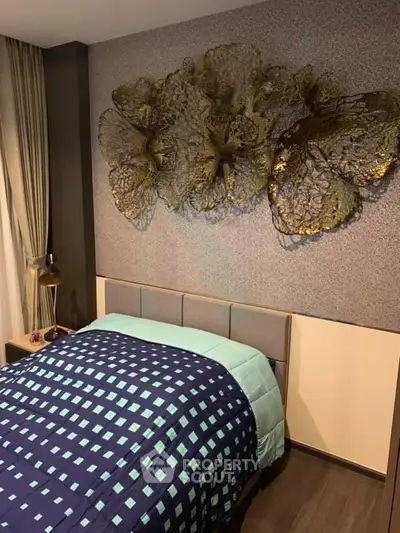 Stylish bedroom with modern decor and elegant wall art