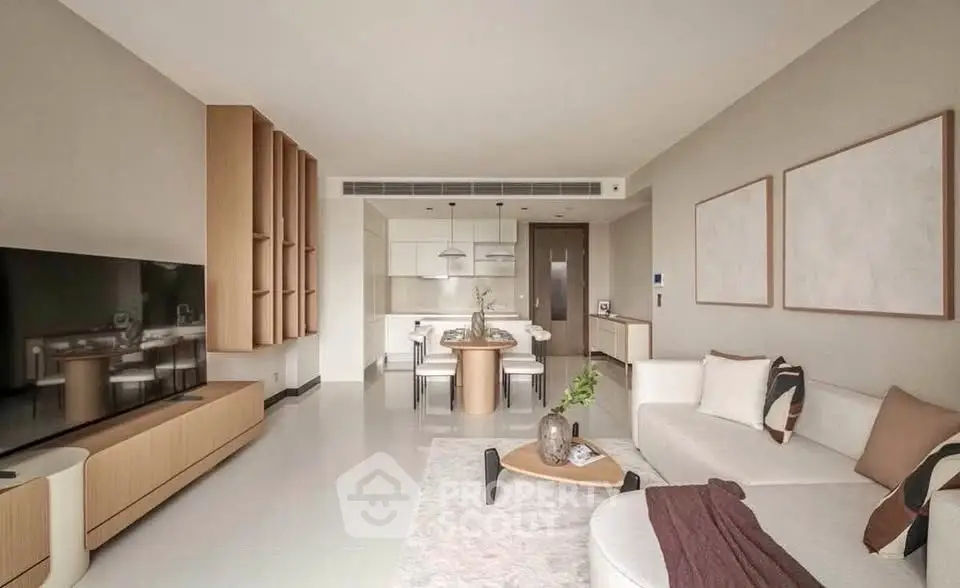 Modern living room with open kitchen, stylish furniture, and neutral tones for a cozy ambiance.