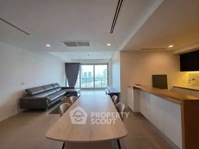 Spacious modern living room with city view and open kitchen layout