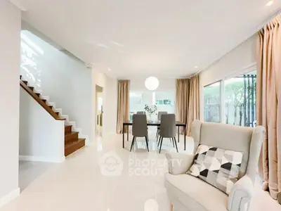 Spacious modern living room with elegant dining area and natural light