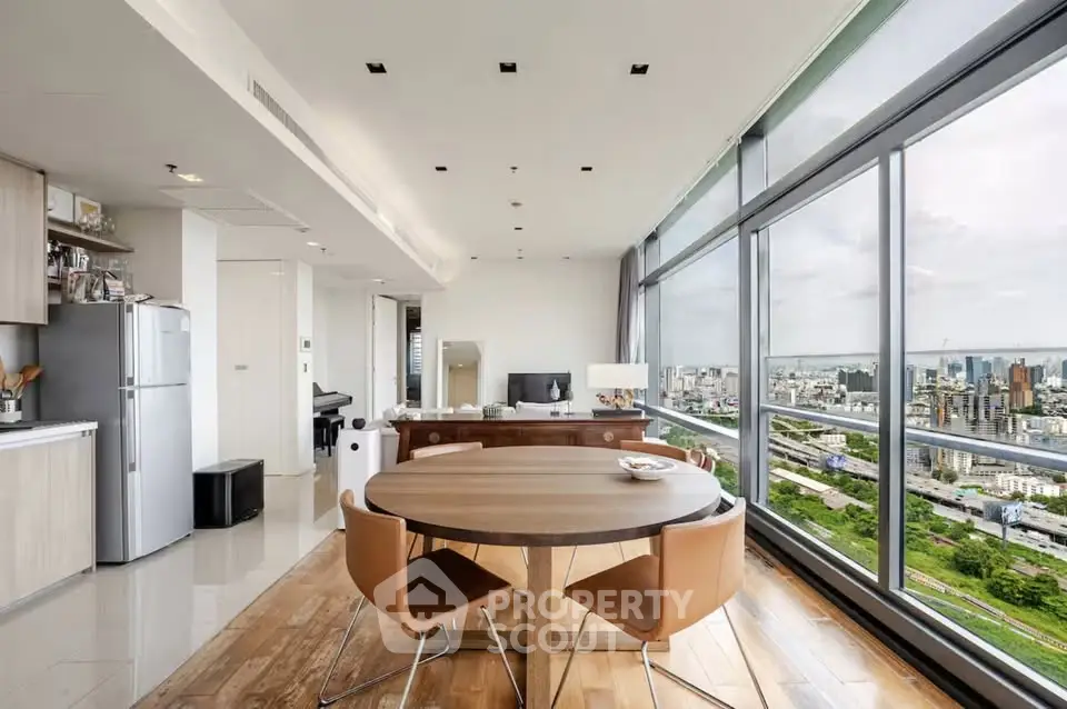 Stunning modern apartment with panoramic city views and open-plan kitchen.