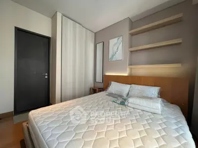 Modern bedroom with stylish decor and ample natural light