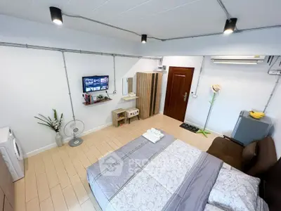 Modern bedroom with stylish decor and in-room appliances