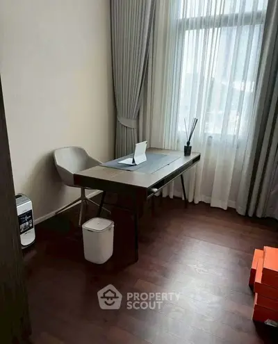 Modern study room with sleek desk and natural light