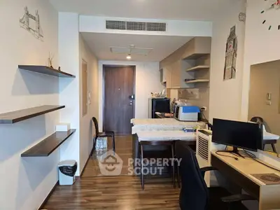 Modern apartment interior with open layout, featuring a cozy living area and stylish kitchen.