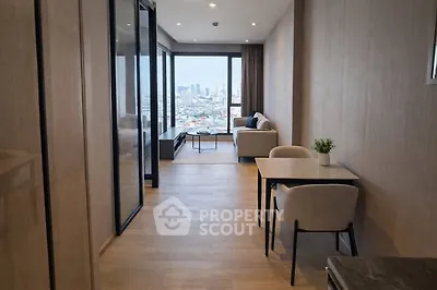 Modern apartment interior with city view, featuring stylish living area and dining space.