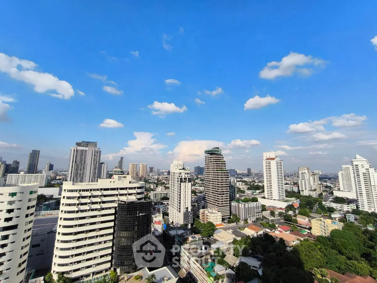Stunning cityscape view with modern high-rise buildings under a clear blue sky.