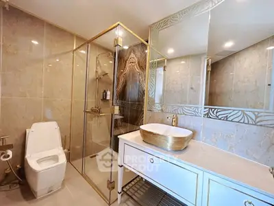 Luxurious bathroom with elegant gold accents and modern fixtures