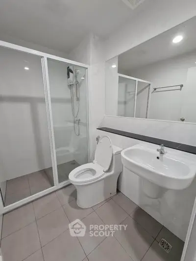 Modern bathroom with glass shower and sleek fixtures