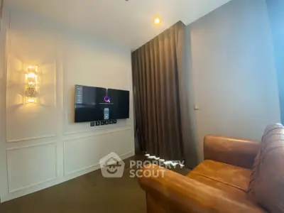 Cozy living room with modern TV setup and elegant lighting