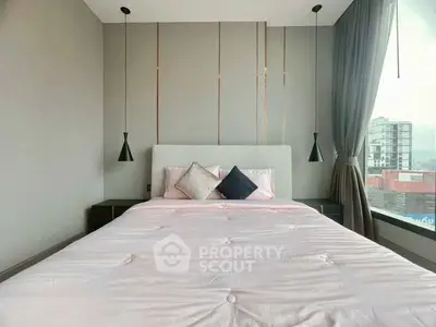 Modern bedroom with stylish decor and large window view