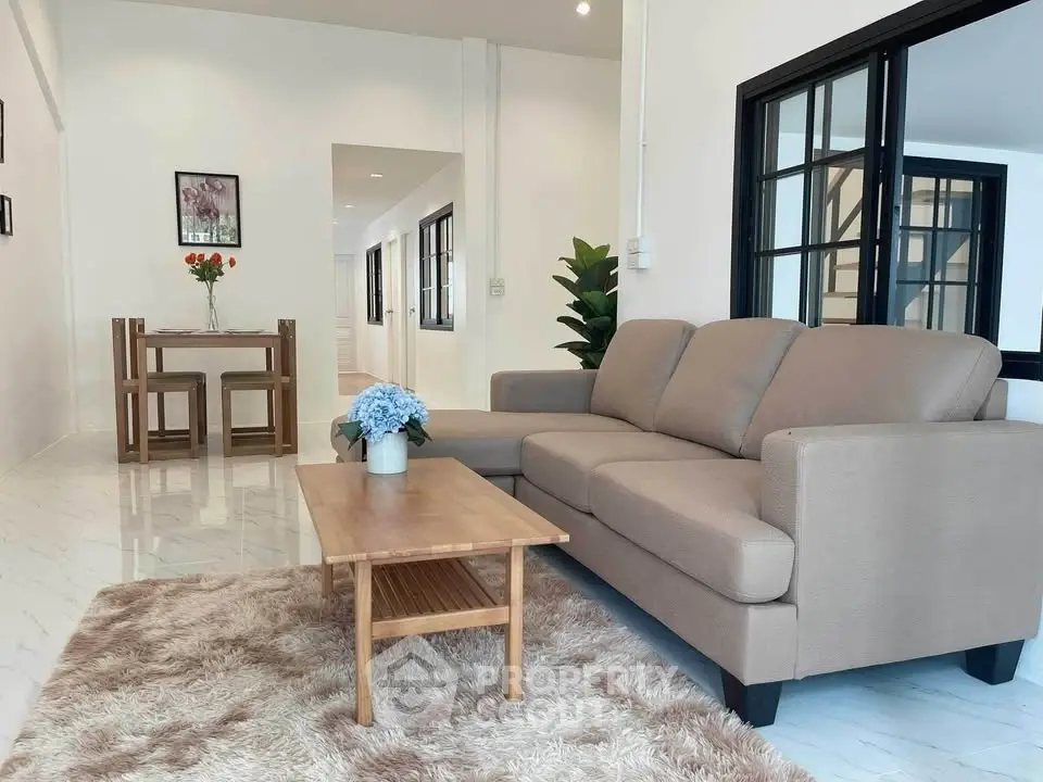 Spacious living room with cozy sofa and elegant decor