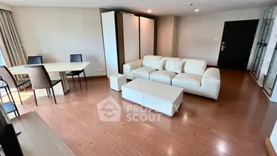 Spacious modern living room with elegant furniture and hardwood floors