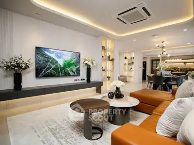 Luxurious modern living room with elegant decor and spacious seating area, perfect for relaxation and entertainment.