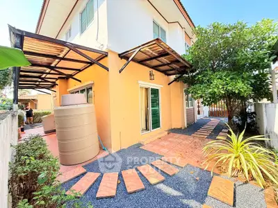 Charming two-story home with spacious garden and modern exterior design