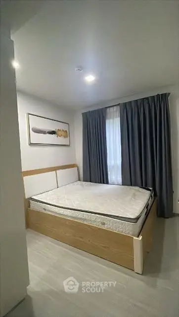 Cozy modern bedroom with stylish decor and natural light