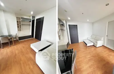 Modern living room with sleek furniture and wooden flooring in a stylish apartment.