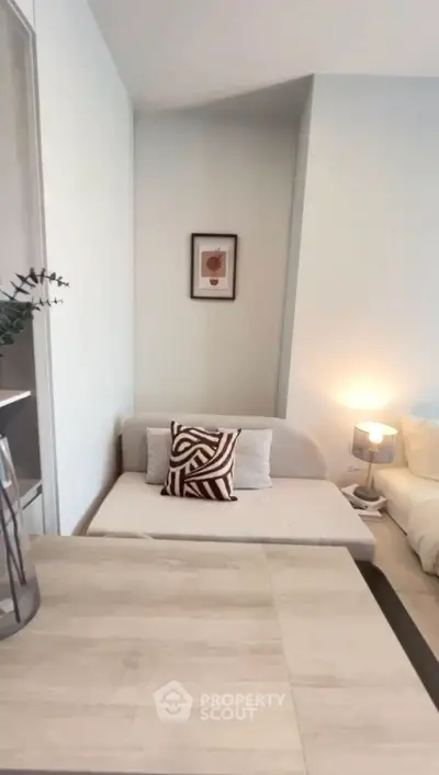 Cozy living room with modern decor and comfortable seating in a stylish apartment.