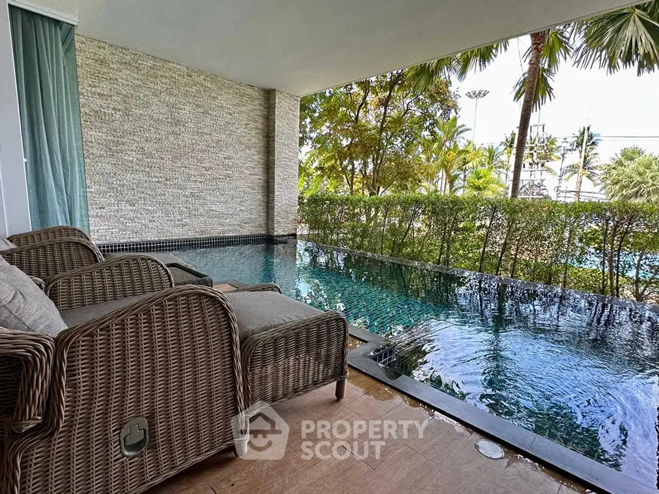 Luxurious poolside view with elegant wicker chairs and lush greenery