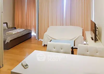 Spacious studio apartment with modern furnishings and natural light