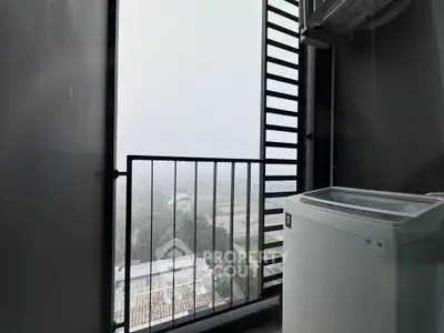 Modern balcony with washing machine and panoramic view of cityscape.