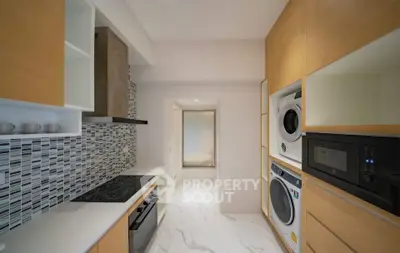 Modern kitchen with sleek appliances and stylish cabinetry
