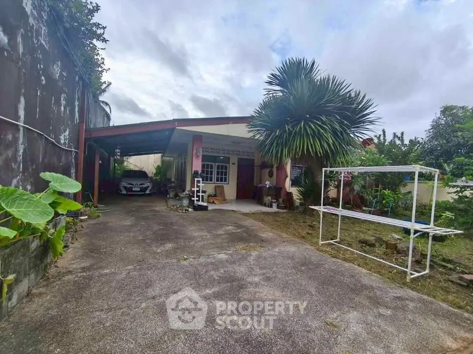 Charming suburban home with spacious driveway and lush greenery, perfect for family living.