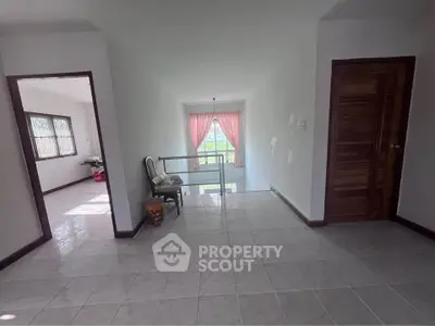 Spacious hallway with natural light and elegant decor