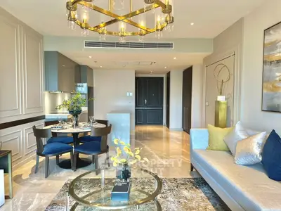 Luxurious living room with elegant decor and modern dining area in upscale apartment.