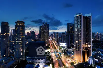 Stunning cityscape view of illuminated skyscrapers at dusk, showcasing urban luxury living.