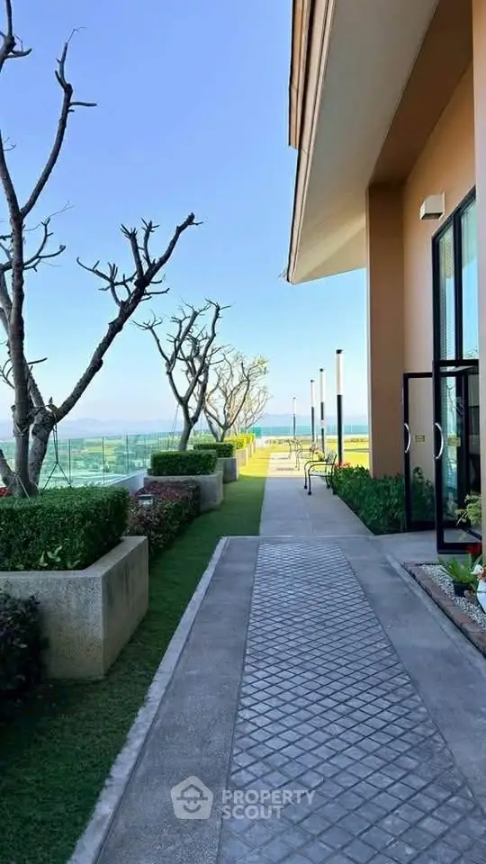 Stunning rooftop garden with ocean view and modern architecture, perfect for relaxation and leisure.