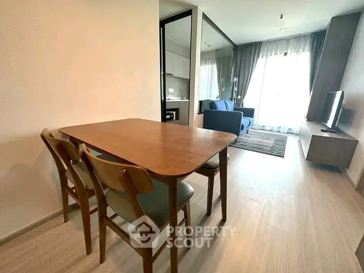 Modern open-plan living room with dining area and stylish furniture