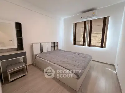 Modern minimalist bedroom with sleek furniture and natural light