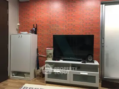 Stylish living room with modern TV stand and brick accent wall