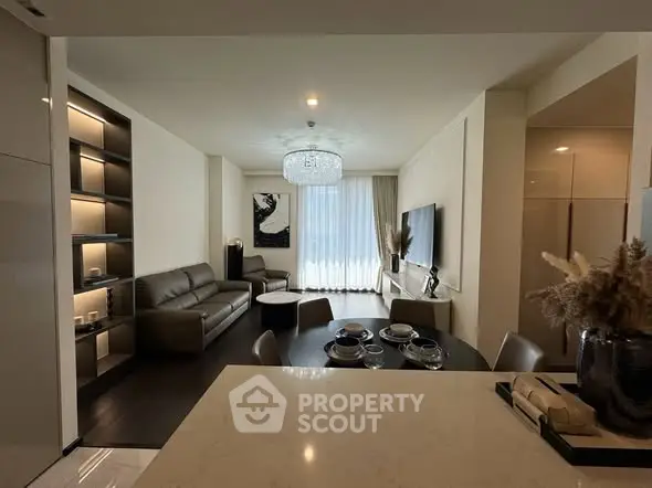 Luxurious modern living room with elegant decor and open dining area, perfect for stylish urban living.