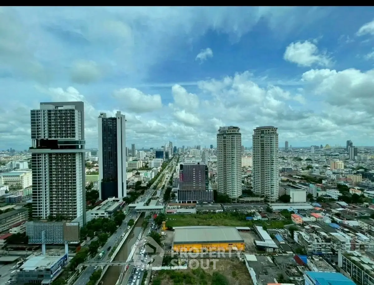 Stunning cityscape view showcasing modern high-rise buildings and urban skyline under a vibrant blue sky.
