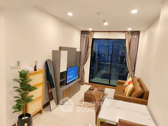 Modern living room with stylish decor and balcony view