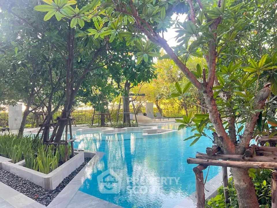 Luxurious outdoor pool surrounded by lush greenery in a serene residential setting.