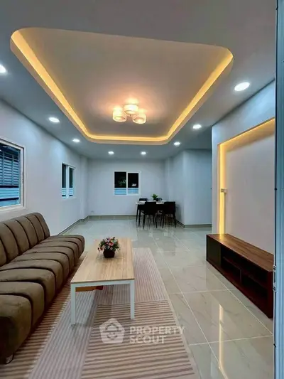 Modern living room with stylish lighting and cozy seating area
