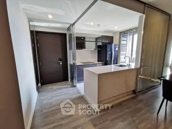 Modern kitchen with sleek design and open layout in a stylish apartment.