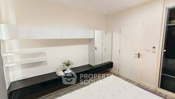 Modern bedroom with sleek storage and minimalist design